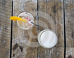 Two drinks on a wooden rustic table.
