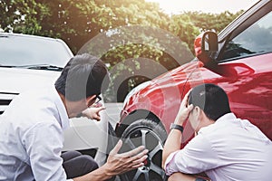 Two drivers man arguing after a car traffic accident collision,