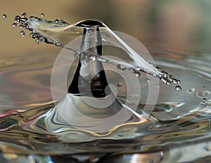 Two drops of water colliding, with second drop