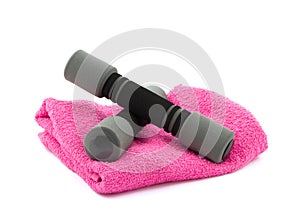 Two dumbbells on a towel