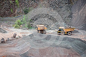 Two dumper trucks in a quarry