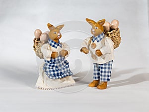 Two easter bunnies with baskets and eggs