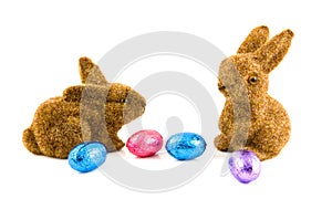 Two easter bunnies with easter eggs