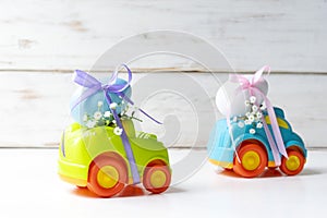 Two Easter cars with an egg