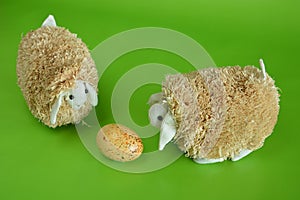 Two easter sheep on green background