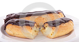 Two Eclairs on White Plate