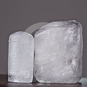 Two ecologic deodorant crystal in grey background