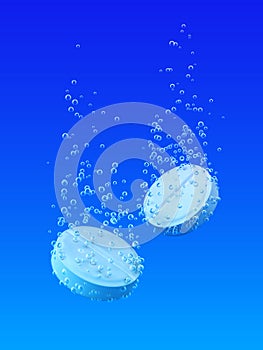 Two effervescent tablet with bubbles.