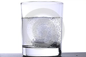 Two effervescent tablets in glass