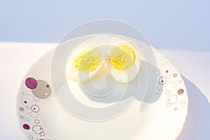 Two Egg cutting pitch with pink background