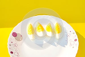 Two Egg cutting pitch yellow background