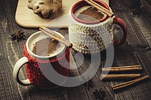 two eggnog mugs with grated nutmeg, cinnamon and cake/two eggnog mugs with grated nutmeg, cinnamon and cake. Top view