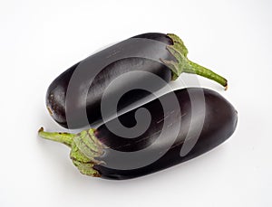 Two eggplants are parallel to each other. Vegetables isolated on a white background.