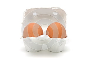 Two eggs in carton