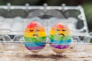 Two eggs are colored in the colors of the rainbow as a flag of gays and lesbians as well as Easter eggs. Homosexual concept