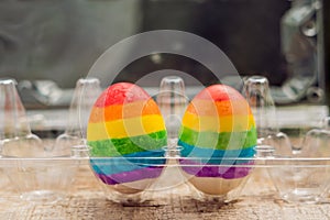 Two eggs are colored in the colors of the rainbow as a flag of gays and lesbians as well as Easter eggs. Homosexual