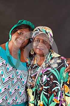 Two elderly African American sisters wearing colorful  turbans photo