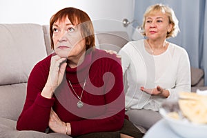 Two elderly women squabbling