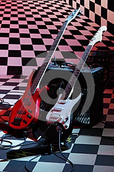 Two electric guitars and sound amplifying equipment