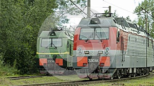 Two electric trains standing on the railway tracks