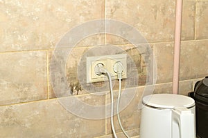 Two electrical outlets on the wall.