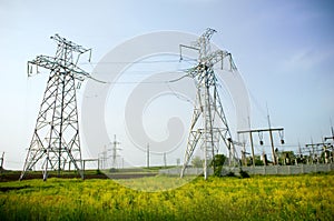 Two electrical towers on blue sky background