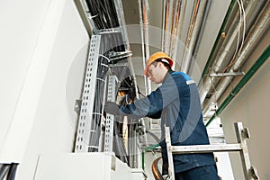 Two electrician workers at cabling