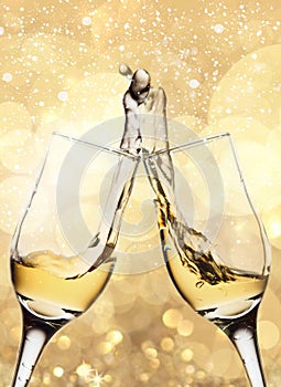 Two elegant glasses with sparkling champagne with splash