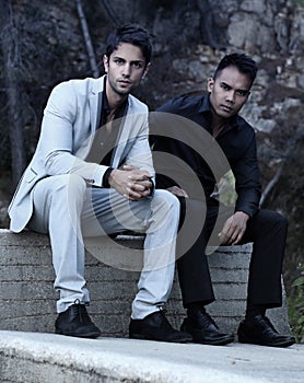 Two elegant men posing outdoor