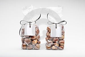 Two elegant plastic bags of sweet chestnuts for gift