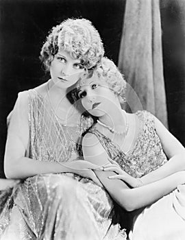 Two elegant women sitting together