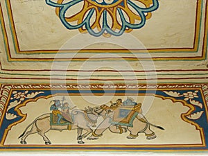 Two elephants fighting on the wall of an ancient palace or haveli in Mandawa, Rajasthan, India