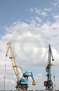 Two elevating cranes