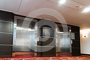 Two elevators with metal doors in hotel
