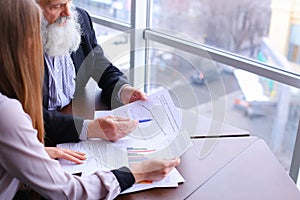 Two employees of company of young and old people to discuss prob