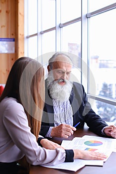 Two employees of company of young and old people to discuss prob