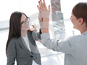 Two employees are discussing a new project