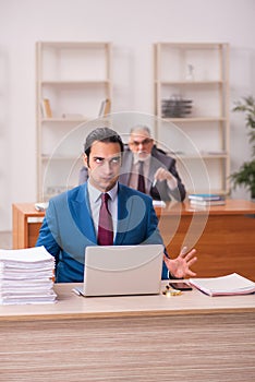 Two employees working in the office