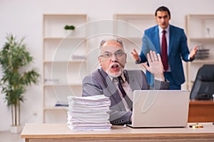 Two employees working in the office