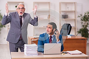 Two employees working in the office