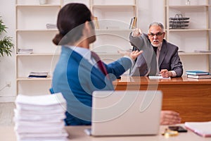 Two employees working in the office