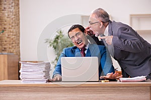 Two employees working in the office