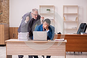 Two employees working in the office