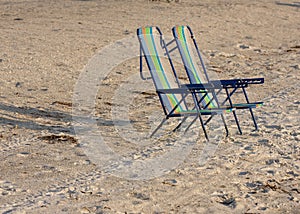 Two empty beach chairs.