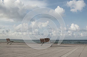 Two Empty Benches by the Sea