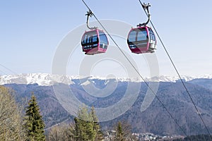 Two empty cable cars climbing