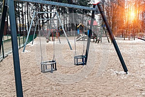 Two empty children swings