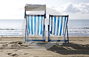 Two empty deck chairs