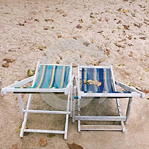 Two empty deck chairs on the beach, Summer holiday concept