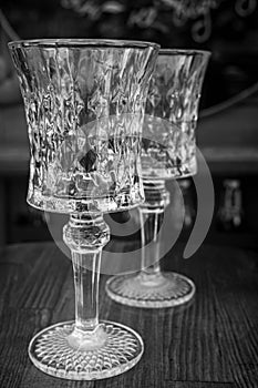 Two empty old fashioned crystal wine glasses